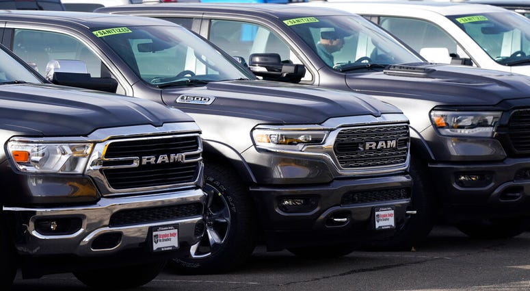 A long row of unsold 2020 pickup trucks sits at a Ram dealership Sunday, Dec. 27, 2020, in Littleton, Colo. (AP Photo/David Zalubowski) A long row of unsold 2020 pickup trucks sits at a Ram dealership Sunday, Dec. 27, 2020, in Littleton, Colo. (AP Photo/David Zalubowski)