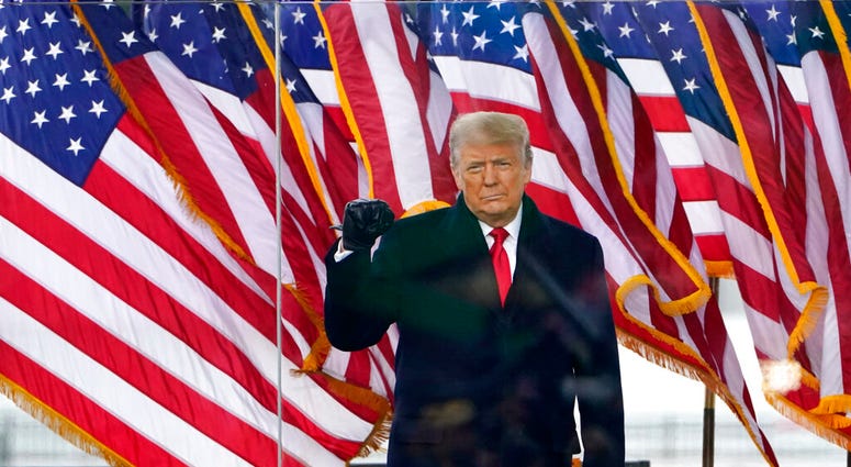 President Donald Trump arrives to speak at a rally Wednesday, Jan. 6, 2021, in Washington.