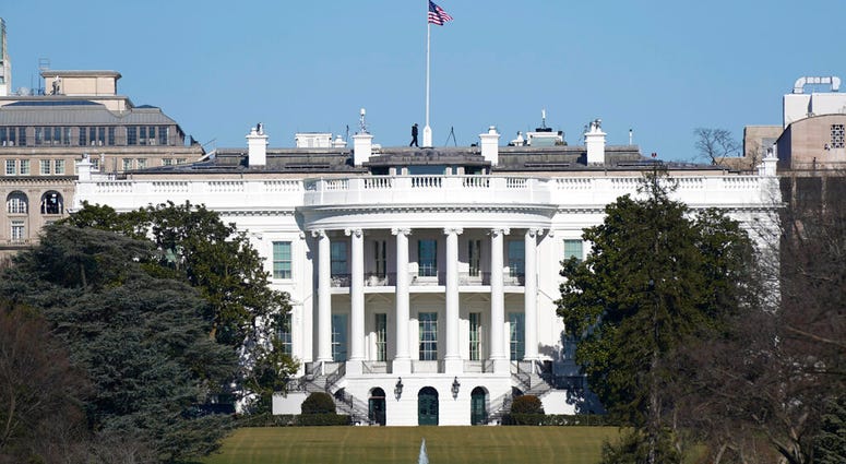 An American flag flies above the White House in Washington, Saturday, Jan. 9, 2021.