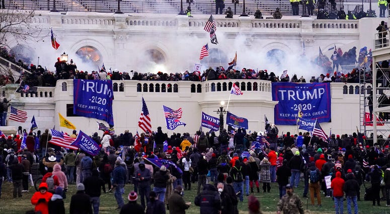 In this Wednesday, Jan. 6, 2021, file photo, violent protesters, loyal to President Donald Trump, storm the Capitol, in Washington. (AP Photo/John Minchillo, File) In this Wednesday, Jan. 6, 2021, file photo, violent protesters, loyal to President Donald Trump, storm the Capitol, in Washington. (AP Photo/John Minchillo, File)