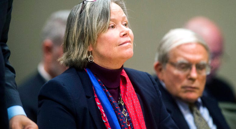 FILE - In this Dec. 7, 2018 file photo, former Michigan state medical executive Dr. Eden Wells appears in Flint, Mich. Wells, was charged. (Jake May/The Flint Journal via AP) FILE - In this Dec. 7, 2018 file photo, former Michigan state medical executive Dr. Eden Wells appears in Flint, Mich. Wells, was charged. (Jake May/The Flint Journal via AP)