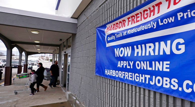In this Dec. 10, 2020, file photo, a "Now Hiring" sign hangs on the front wall of a Harbor Freight Tools store in Manchester, N.H. (AP Photo/Charles Krupa, File) In this Dec. 10, 2020, file photo, a "Now Hiring" sign hangs on the front wall of a Harbor Freight Tools store in Manchester, N.H. (AP Photo/Charles Krupa, File)