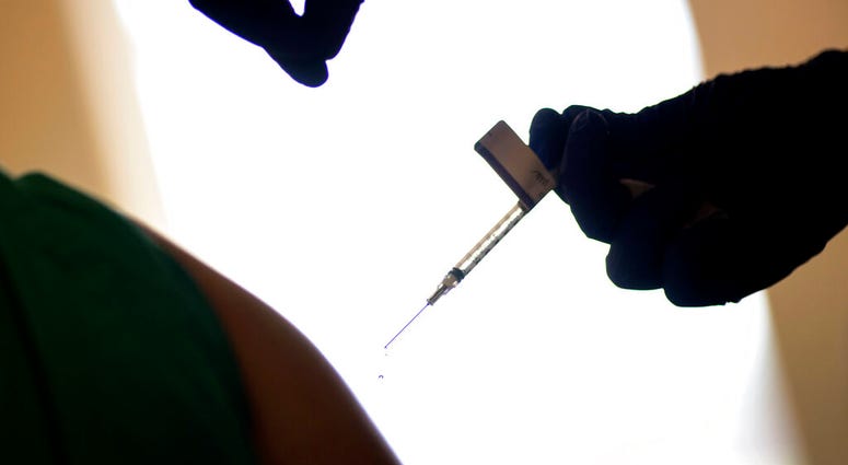 In this Dec. 15, 2020, file photo, a droplet falls from a syringe after a health care worker was injected with the Pfizer-BioNTech COVID-19 vaccine at Women & Infants Hospital in Providence, R.I. (AP Photo/David Goldman, File) In this Dec. 15, 2020, file photo, a droplet falls from a syringe after a health care worker was injected with the Pfizer-BioNTech COVID-19 vaccine at Women & Infants Hospital in Providence, R.I. (AP Photo/David Goldman, File)
