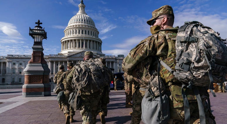 National Guard troops reinforce security around the U.S. Capitol ahead of expected protests leading up to President-elect Joe Biden's inauguration, in Washington, Sunday, Jan. 17, 2021, following the deadly attack on Congress by a mob of supporters of Pre