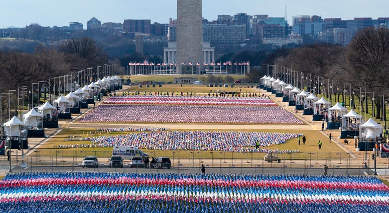 Flags are placed on the National Mall, looking towards the Washington Monument, and the Lincoln Memorial, ahead of the inauguration of President-elect Joe Biden and Vice President-elect Kamala Harris, Monday, Jan. 18, 2021, in Washington. Flags are placed on the National Mall, looking towards the Washington Monument, and the Lincoln Memorial, ahead of the inauguration of President-elect Joe Biden and Vice President-elect Kamala Harris, Monday, Jan. 18, 2021, in Washington.