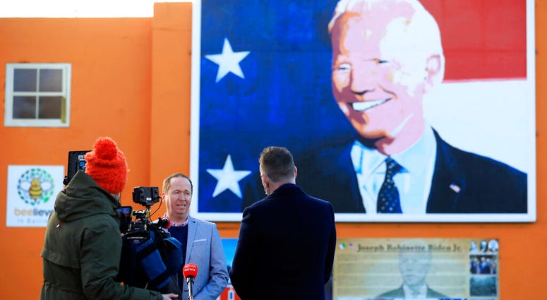 Joe Biden's cousin Joe Blewitt speaks to the media underneath his mural painted on a wall in Ballina, Ireland, Wednesday, Jan. 20, 2021. (AP Photo/Peter Morrison) Joe Biden's cousin Joe Blewitt speaks to the media underneath his mural painted on a wall in Ballina, Ireland, Wednesday, Jan. 20, 2021. (AP Photo/Peter Morrison)