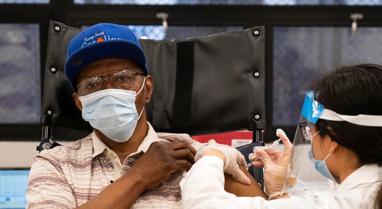 In this Jan. 15, 2021, file photo, a nursing home resident receives the COVID-19 vaccine by a CVS Pharmacist at Harlem Center for Nursing and Rehabilitation, a nursing home facility in Harlem neighborhood of New York. (AP Photo/Yuki Iwamura) In this Jan. 15, 2021, file photo, a nursing home resident receives the COVID-19 vaccine by a CVS Pharmacist at Harlem Center for Nursing and Rehabilitation, a nursing home facility in Harlem neighborhood of New York. (AP Photo/Yuki Iwamura)