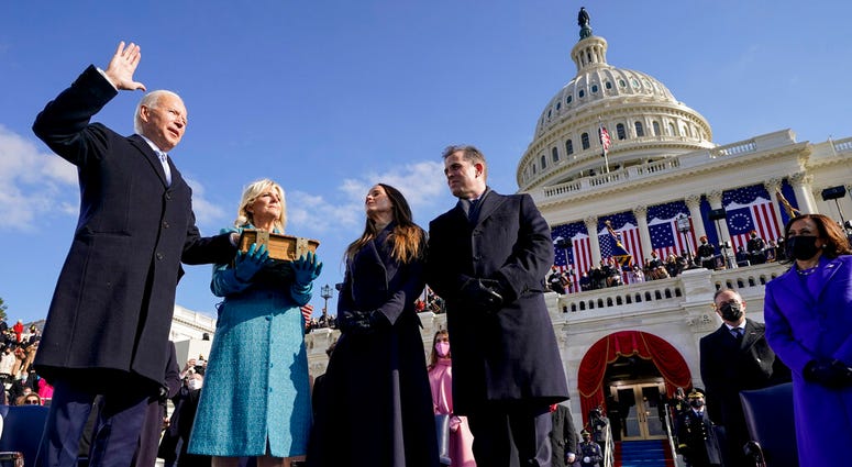 Joe Biden is sworn in as the 46th president of the United States by Chief Justice John Roberts as Jill Biden holds the Bible. (AP Photo/Andrew Harnik, Pool) Joe Biden is sworn in as the 46th president of the United States by Chief Justice John Roberts as Jill Biden holds the Bible. (AP Photo/Andrew Harnik, Pool)