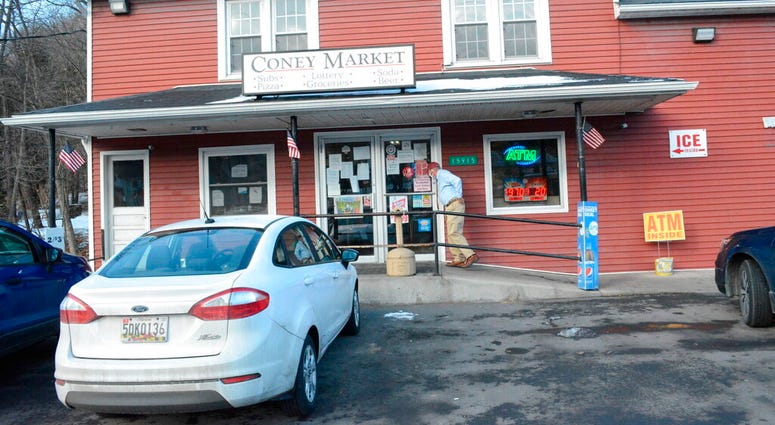 A patron approaches the entrance to Coney Market, a convenience store Lonaconing, Md., where the jackpot-winning Powerball ticket worth $731.1 million was sold in a struggling coal mining town. (Steven Bittner/Cumberland Times-News via AP) A patron approaches the entrance to Coney Market, a convenience store Lonaconing, Md., where the jackpot-winning Powerball ticket worth $731.1 million was sold in a struggling coal mining town. (Steven Bittner/Cumberland Times-News via AP)