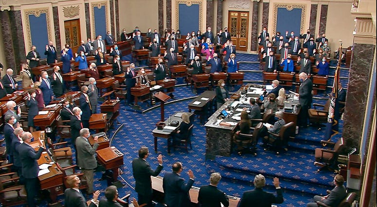 In this image from video, Sen. Patrick Leahy, D-Vt., the president pro tempore of the Senate, who is presiding over the impeachment trial of former President Donald Trump, swears in members of the Senate. (Senate Television via AP) In this image from video, Sen. Patrick Leahy, D-Vt., the president pro tempore of the Senate, who is presiding over the impeachment trial of former President Donald Trump, swears in members of the Senate. (Senate Television via AP)