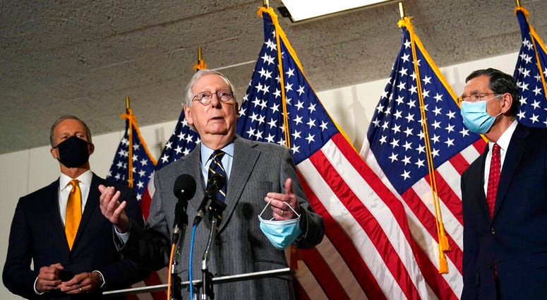 Senate Minority Leader Mitch McConnell of Ky., center, flanked by Sen. John Thune, R-S.D., left, and Sen. John Barrasso, R-Wyo., right, speaks during a news conference on Capitol Hill in Washington, Tuesday, Jan. 26, 2021. (AP Photo/Susan Walsh) Senate Minority Leader Mitch McConnell of Ky., center, flanked by Sen. John Thune, R-S.D., left, and Sen. John Barrasso, R-Wyo., right, speaks during a news conference on Capitol Hill in Washington, Tuesday, Jan. 26, 2021. (AP Photo/Susan Walsh)