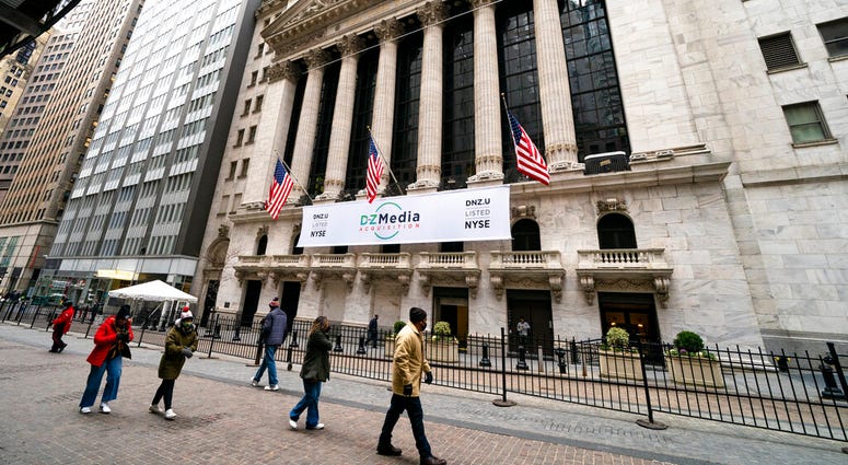 Pedestrians pass the New York Stock Exchange, Wednesday, Jan. 27, 2021, in New York. (AP Photo/John Minchillo) Pedestrians pass the New York Stock Exchange, Wednesday, Jan. 27, 2021, in New York. (AP Photo/John Minchillo)