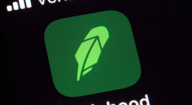 FILE - This Dec. 17, 2020 file photo shows the logo for the Robinhood app on a smartphone in New York.
