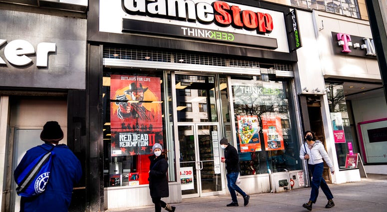 FILE - Pedestrians pass a GameStop store on 14th Street at Union Square, Thursday, Jan. 28, 2021, in the Manhattan borough of New York. (AP Photo/John Minchillo, File) FILE - Pedestrians pass a GameStop store on 14th Street at Union Square, Thursday, Jan. 28, 2021, in the Manhattan borough of New York. (AP Photo/John Minchillo, File)