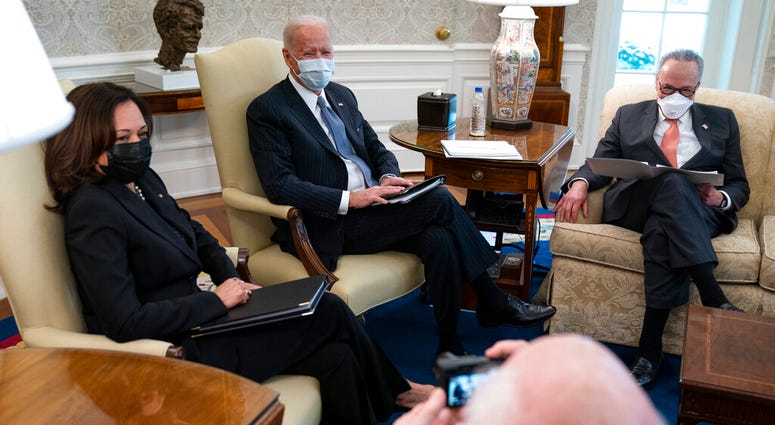 Vice President Kamala Harris, President Joe Biden, and Senate Majority Leader Sen. Chuck Schumer of N.Y., during a meeting to discuss a coronavirus relief package, in the Oval Office of the White House, Wednesday, Feb. 3, 2021, in Washington. Vice President Kamala Harris, President Joe Biden, and Senate Majority Leader Sen. Chuck Schumer of N.Y., during a meeting to discuss a coronavirus relief package, in the Oval Office of the White House, Wednesday, Feb. 3, 2021, in Washington.