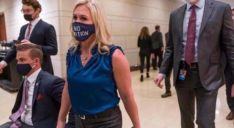 Rep. Marjorie Taylor Greene, R-Ga., walks with fellow House Republicans on Capitol Hill in Washington, Wednesday, Feb. 3, 2021. (AP Photo/J. Scott Applewhite) Rep. Marjorie Taylor Greene, R-Ga., walks with fellow House Republicans on Capitol Hill in Washington, Wednesday, Feb. 3, 2021. (AP Photo/J. Scott Applewhite)