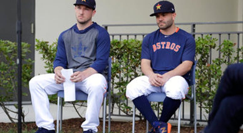 Houston Astros infielder Alex Bregman, left, and Jose Altuve sit in chairs as they wait to deliver statements during a news conference before the start of the first official spring training baseball practice for the team Thursday. (AP Photo/Jeff Roberson) Houston Astros infielder Alex Bregman, left, and Jose Altuve sit in chairs as they wait to deliver statements during a news conference before the start of the first official spring training baseball practice for the team Thursday. (AP Photo/Jeff Roberson)