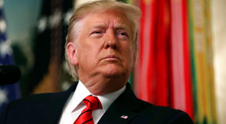 President Donald Trump listens to a question as he speaks in the Diplomatic Room of the White House in Washington, Sunday, Oct. 27, 2019. (AP Photo/Andrew Harnik)