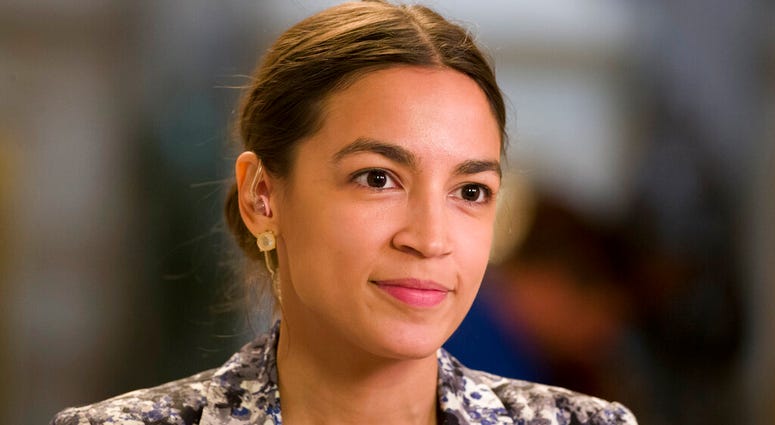 Rep. Alexandria Ocasio-Cortez, D-N.Y., prepares to do a television interview on Capitol Hill, Thursday, June 27, 2019 in Washington. (AP Photo/Alex Brandon)