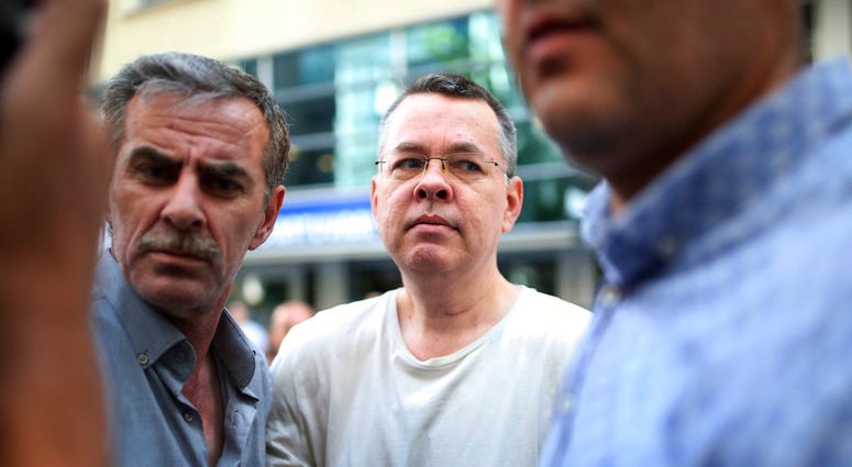 In this July 25, 2018 photo, Andrew Craig Brunson, an evangelical pastor from North Carolina, arrives at his house in Turkey. Brunson had been jailed in Turkey for more than one and a half years. (AP Photo/Emre Tazegul)