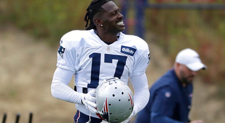 New England Patriots wide receiver Antonio Brown carries his helmet during an NFL football practice, Wednesday, Sept. 18, 2019, in Foxborough, Mass. (AP Photo/Steven Senne)