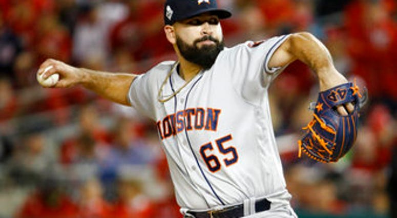 Houston Astros starting pitcher Jose Urquidy throws against the Washington Nationals during the first inning of Game 4 of the baseball World Series Saturday, Oct. 26, 2019, in Washington. (AP Photo/Patrick Semansky)