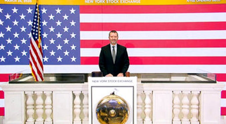 In this photo taken from video provided by the New York Stock Exchange, Director of Facilities & Building Operations James Katsarelis rings the opening bell at the NYSE, on Wednesday, March 25, 2020. (New York Stock Exchange via AP) In this photo taken from video provided by the New York Stock Exchange, Director of Facilities & Building Operations James Katsarelis rings the opening bell at the NYSE, on Wednesday, March 25, 2020. (New York Stock Exchange via AP)