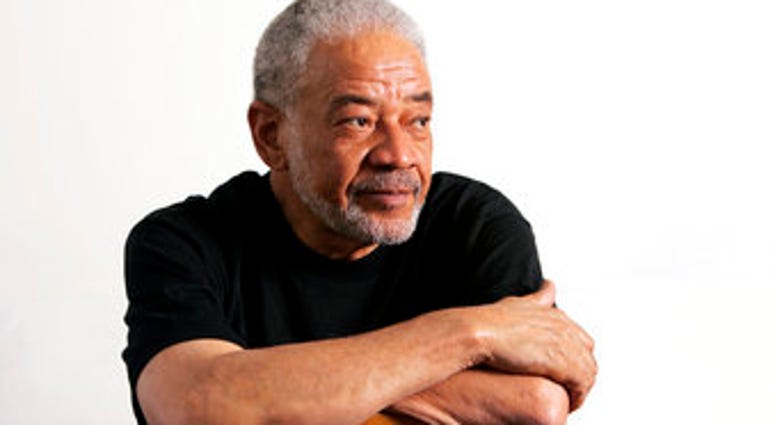 FILE - In this June 21, 2006 file photo, singer-songwriter Bill Withers poses in his office in Beverly Hills, Calif. (AP Photo/Reed Saxon, File) FILE - In this June 21, 2006 file photo, singer-songwriter Bill Withers poses in his office in Beverly Hills, Calif. (AP Photo/Reed Saxon, File)