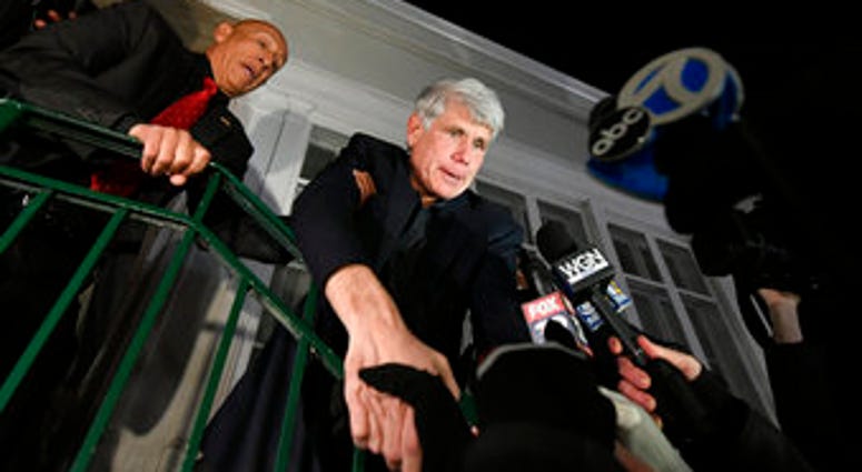 Former Illinois Gov. Rod Blagojevich shakes hands with a supporter as he arrives home in Chicago on Wednesday, Feb. 19, 2020, after his release from Colorado prison late Tuesday. (AP Photo/Paul Beaty) Former Illinois Gov. Rod Blagojevich shakes hands with a supporter as he arrives home in Chicago on Wednesday, Feb. 19, 2020, after his release from Colorado prison late Tuesday. (AP Photo/Paul Beaty)