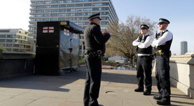 Police officers stand outside St Thomas' Hospital in central London as British Prime Minister Boris Johnson was moved to intensive care after his coronavirus symptoms worsened in London, Tuesday, April 7, 2020. (AP Photo/Kirsty Wigglesworth) Police officers stand outside St Thomas' Hospital in central London as British Prime Minister Boris Johnson was moved to intensive care after his coronavirus symptoms worsened in London, Tuesday, April 7, 2020. (AP Photo/Kirsty Wigglesworth)