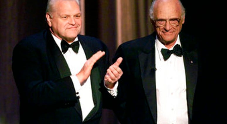 FILE - In this June 6, 1999 file photo, actor Brian Dennehy, left, applauds playwright, Arthur Miller, before awarding him the Lifetime Achievement Award at the Tony Awards in New York. (AP Photo/Kathy Willens, File) FILE - In this June 6, 1999 file photo, actor Brian Dennehy, left, applauds playwright, Arthur Miller, before awarding him the Lifetime Achievement Award at the Tony Awards in New York. (AP Photo/Kathy Willens, File)