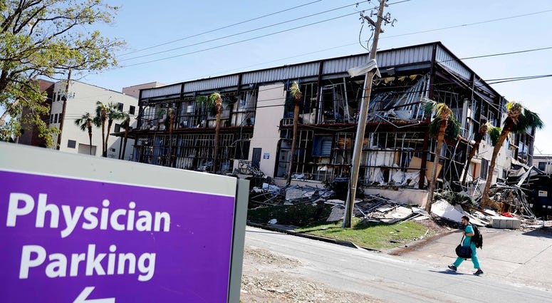 A building at the Bay Medical Center Sacred Heart hospital stands damaged from hurricane Michael in Panama City, Fla., Thursday, Oct. 11, 2018. The devastation inflicted by Hurricane Michael came into focus Thursday with rows upon rows of homes found smas