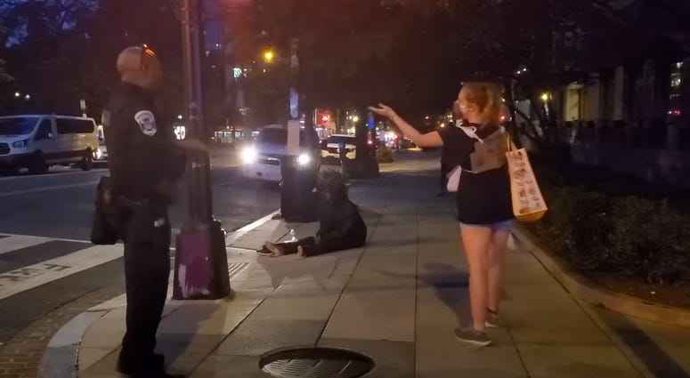 Black officer talks to white protester