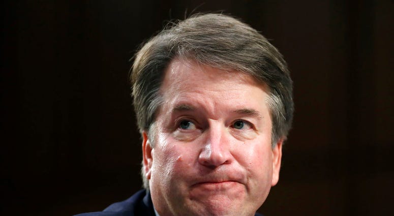 In this Sept. 6, 2018 photo, Supreme Court nominee Brett Kavanaugh reacts as he testifies after questioning before the Senate Judiciary Committee on Capitol Hill in Washington. Official Washington is scrambling Monday to assess and manage Kavanaugh’s pros
