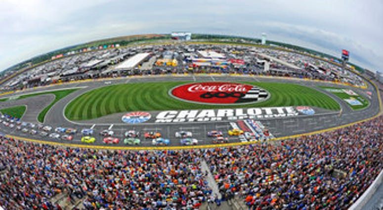 FILE - In this May 27, 2018, file photo, the field takes the green flag to start the NASCAR Cup Series auto race at Charlotte Motor Speedway in Concord, N.C. (AP Photo/Mike McCarn, file) FILE - In this May 27, 2018, file photo, the field takes the green flag to start the NASCAR Cup Series auto race at Charlotte Motor Speedway in Concord, N.C. (AP Photo/Mike McCarn, file)