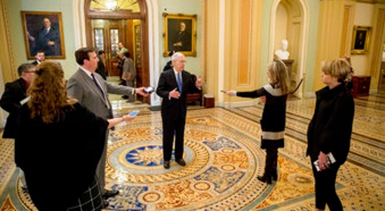 Senate Majority Leader Mitch McConnell of Ky. speaks to reporters outside the Senate chamber after Democrats blocked a coronavirus aid package on Capitol Hill, Monday, March 23, 2020, in Washington. (AP Photo/Andrew Harnik) Senate Majority Leader Mitch McConnell of Ky. speaks to reporters outside the Senate chamber after Democrats blocked a coronavirus aid package on Capitol Hill, Monday, March 23, 2020, in Washington. (AP Photo/Andrew Harnik)