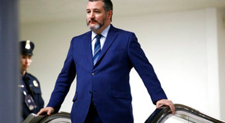FILE - In this Jan. 29, 2020, file photo, Sen. Ted Cruz, R-Texas, rides an escalator before speaking with reporters on Capitol Hill in Washington. (AP Photo/Patrick Semansky, File) FILE - In this Jan. 29, 2020, file photo, Sen. Ted Cruz, R-Texas, rides an escalator before speaking with reporters on Capitol Hill in Washington. (AP Photo/Patrick Semansky, File)