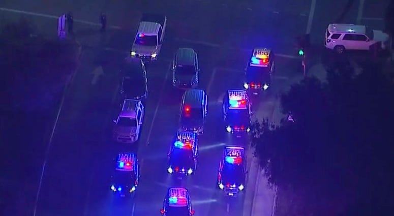Police vehicles block an intersection in the vicinity of a shooting in Thousand Oaks, California, early Thursday, Nov. 8, 2018. (KABC via AP)