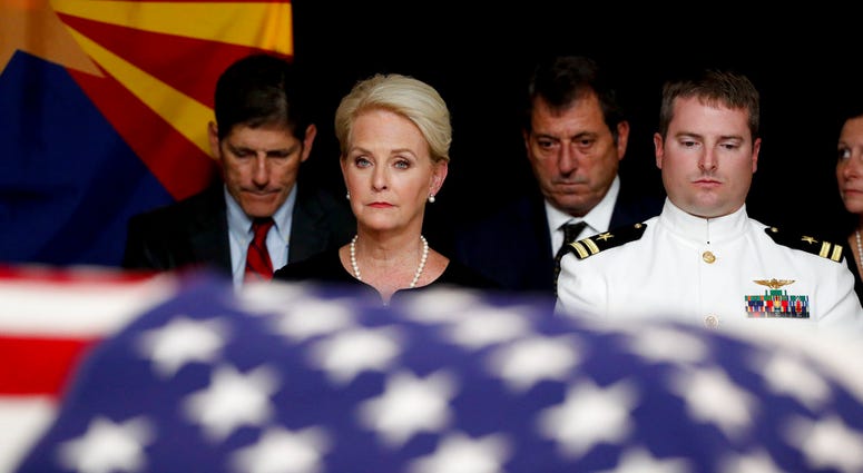 Cindy McCain, wife of Sen. John McCain, R-Ariz. sits with her son Jack during a memorial service at the Arizona Capitol on Wednesday, Aug. 29, 2018, in Phoenix. (AP Photo/Jae C. Hong, Pool)