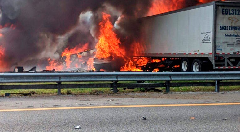 Flames engulf vehicles after a fiery crash along Interstate 75, Thursday, Jan. 3, 2019, about a mile south of Alachua, near Gainesville, Fla. (WGFL-Gainesville via AP)