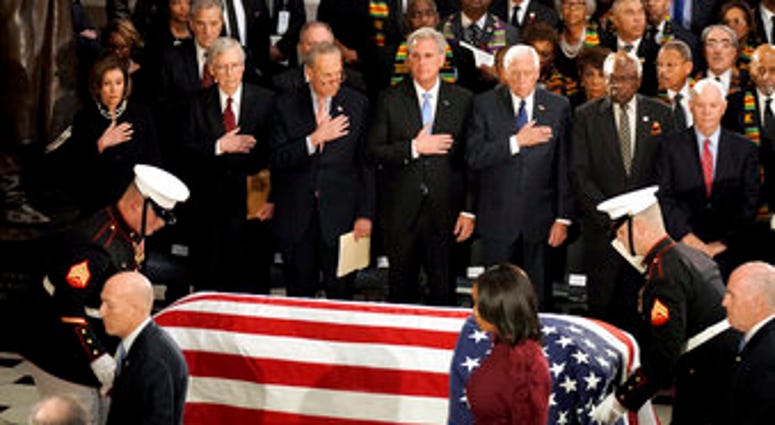 The flag-draped casket of the late Rep. Elijah Cummings, D-Md., arrives for a ceremony in Statuary Hall at the U.S. Capitol in Washington, Thursday, Oct. 24, 2019. (Greg Nash/Pool via AP)