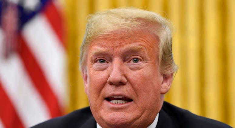President Donald Trump talks about Hurricane Florence following a briefing in the Oval Office of the White House in Washington, Tuesday, Sept. 11, 2018. (AP Photo/Susan Walsh)