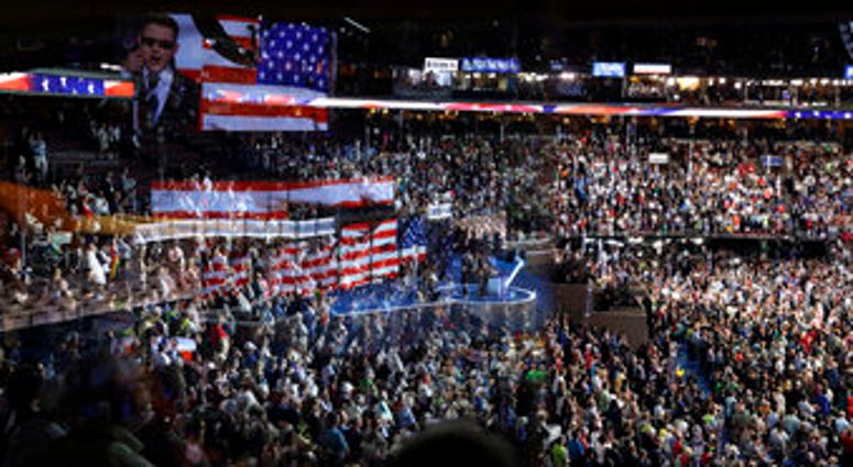 FILE - In this July 26, 2016, file photo the stage is reflected on a glass window on the suite level at Wells Fargo Arena in Philadelphia. (AP Photo/John Locher, File) FILE - In this July 26, 2016, file photo the stage is reflected on a glass window on the suite level at Wells Fargo Arena in Philadelphia. (AP Photo/John Locher, File)