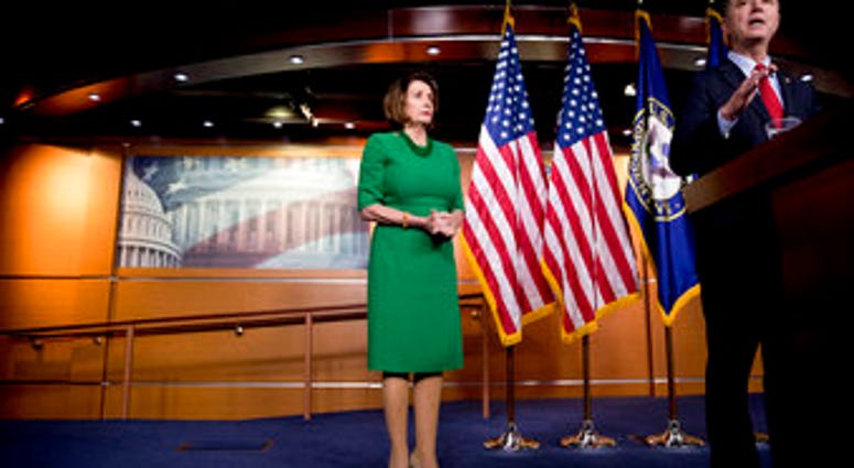 Rep. Adam Schiff, D-Calif., Chairman of the House Intelligence Committee, right, accompanied by House Speaker Nancy Pelosi of Calif., left, speaks about the House impeachment inquiry into President Donald Trump. (AP Photo/Andrew Harnik)