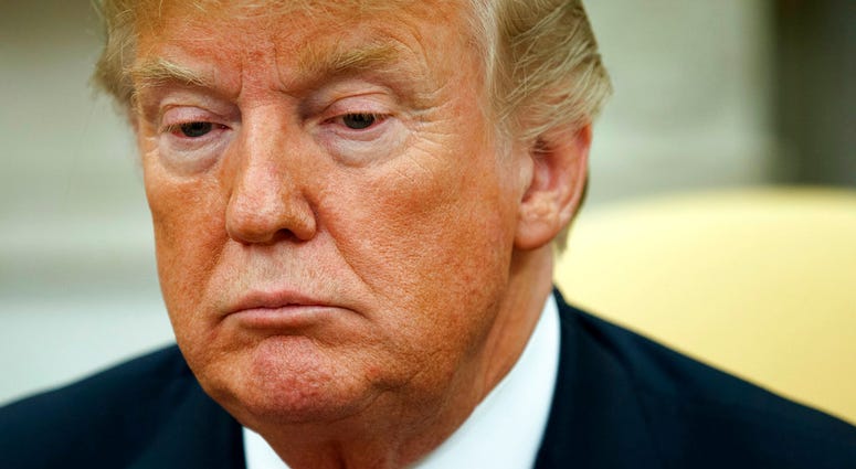 President Donald Trump listens during a meeting with European Commission president Jean-Claude Juncker in the Oval Office of the White House, Wednesday, July 25, 2018, in Washington. (AP Photo/Evan Vucci)