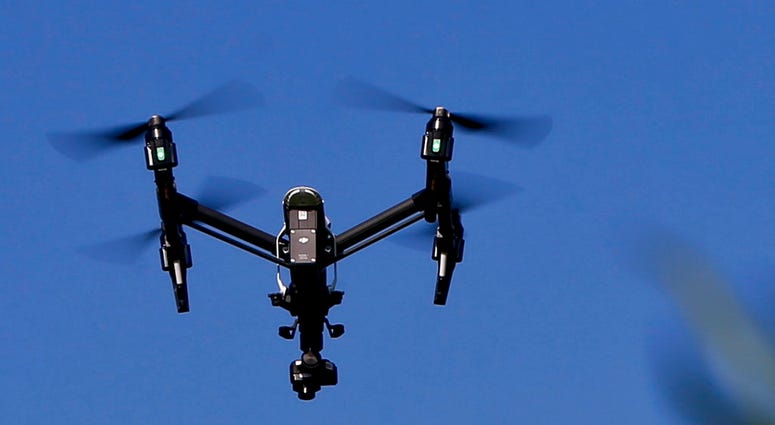 FILE - In this July 11, 2018 file photo, s drone equipped with a thermal camera flies over the plants at the Pennsylvania Department of Natural Resources' Jennings Environmental Education Center on Wednesday, July 11, 2018 in Slippery Rock, Pa. An aviatio