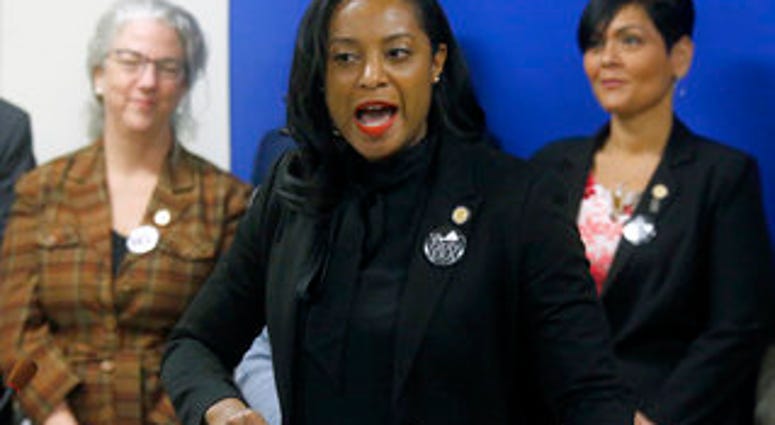 FILE - Jan. 22, 2019 file photo, Del. Jennifer Carroll Foy, D-Prince William, center, speaks during a news conference of ERA supporters after her bill was killed by a House subcommittee. (Bob Brown/Richmond Times-Dispatch via AP) FILE - Jan. 22, 2019 file photo, Del. Jennifer Carroll Foy, D-Prince William, center, speaks during a news conference of ERA supporters after her bill was killed by a House subcommittee. (Bob Brown/Richmond Times-Dispatch via AP)