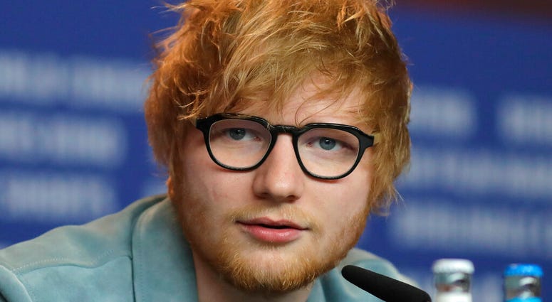 FILE - In this Friday, Feb. 23, 2018 file photo, singer-songwriter Ed Sheeran speaks during a press conference for the film 'Songwriter.' (AP Photo/Markus Schreiber, FILE)