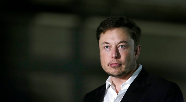 FILE- In this June 24, 2018, file photo Tesla CEO and founder of the Boring Company Elon Musk speaks at a news conference. (AP Photo/Kiichiro Sato, File)