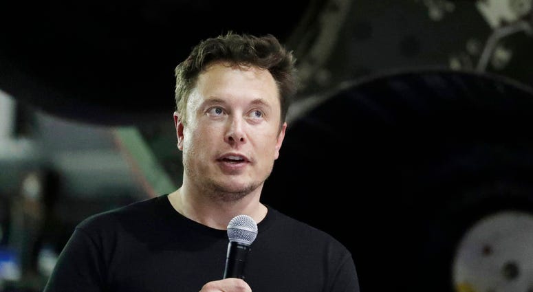 FILE- In this Sept. 17, 2018, file photo SpaceX founder and chief executive Elon Musk speaks after announcing Japanese billionaire Yusaku Maezawa as the first private passenger on a trip around the moon in Hawthorne, Calif. U.S. securities regulators have